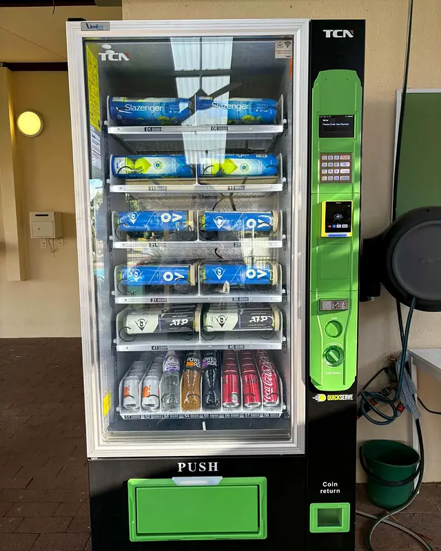 A QuickServe machine at Leederville Tennis Club stocked with Slazenger and Dunlop ball cans, Powerade and Coca-Cola
